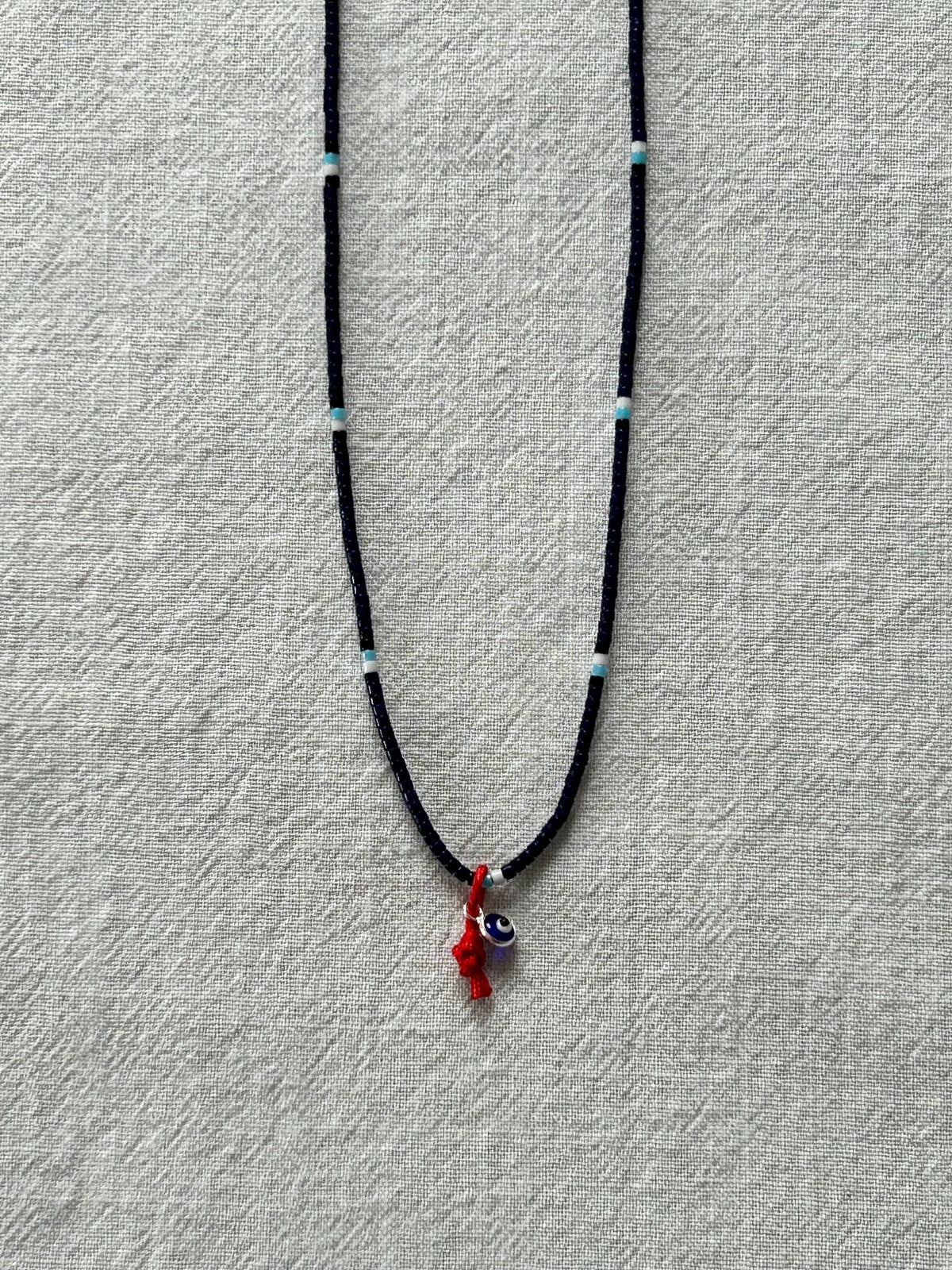 Evil-eye Miyuki necklace on a red string — Koï Design handmade necklace, photo 1