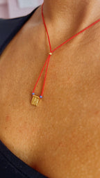 Red string necklace with a gold-plated charm — Koï Design handmade necklace, photo 1