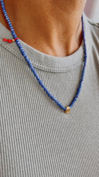 Blue striped glass necklace with a gold-plated charm — Koï Design handmade necklace, photo 1
